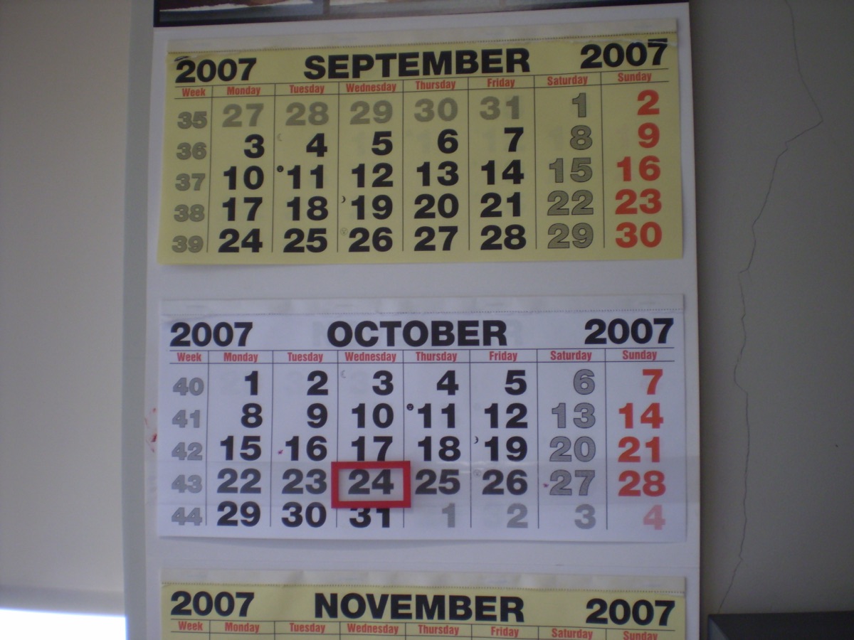 A wall calendar showing the months of September, October and November